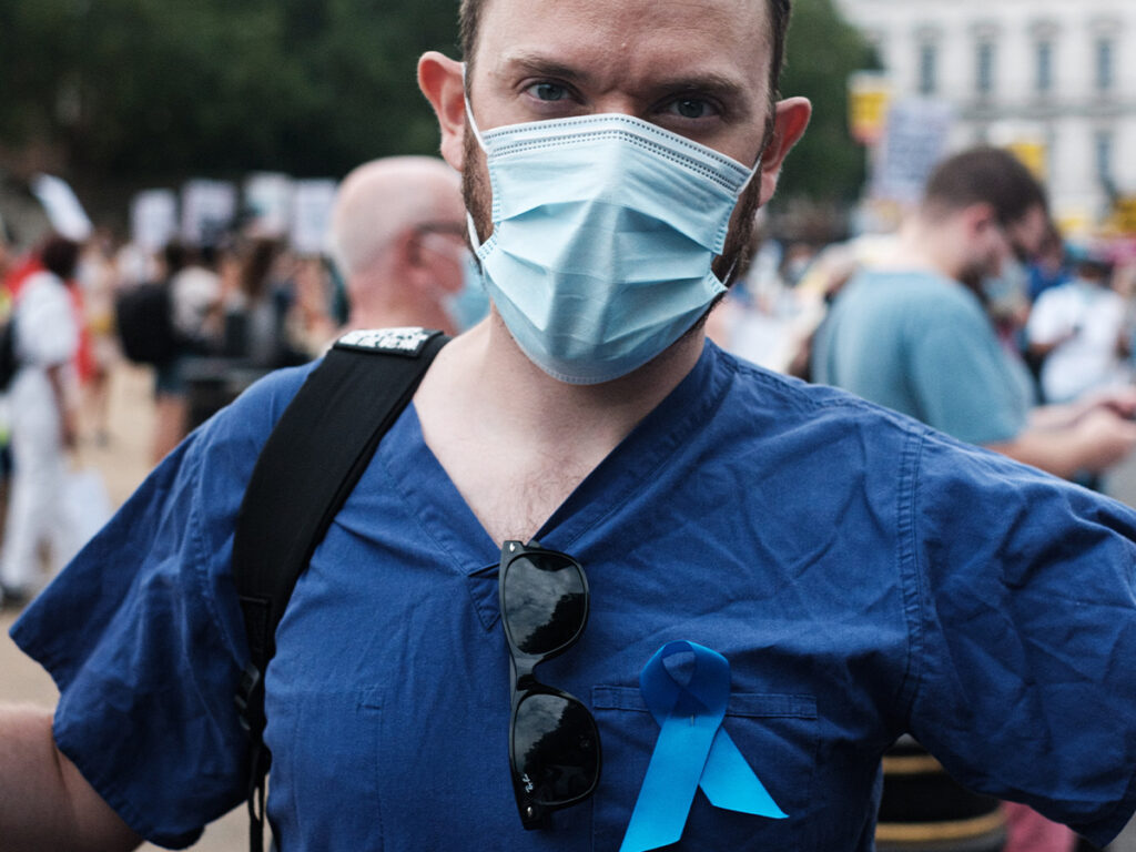 nurse standing outside with mask on