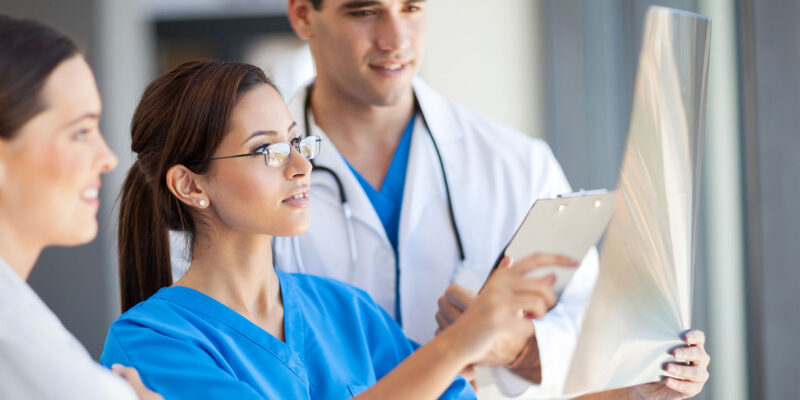 doctors and nurses reviewing scans