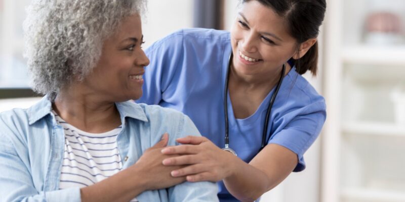nurse working with elderly patient