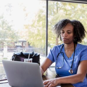 nurse working on laptop