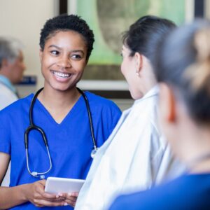 nurse talking to a doctor