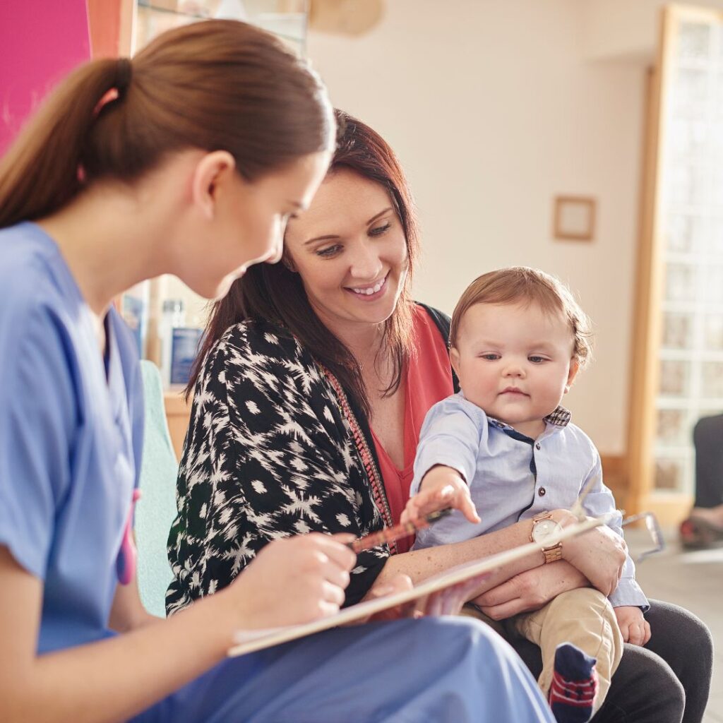 nurse with a patient and a baby