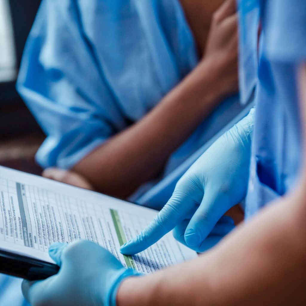 Nurse looking over a document