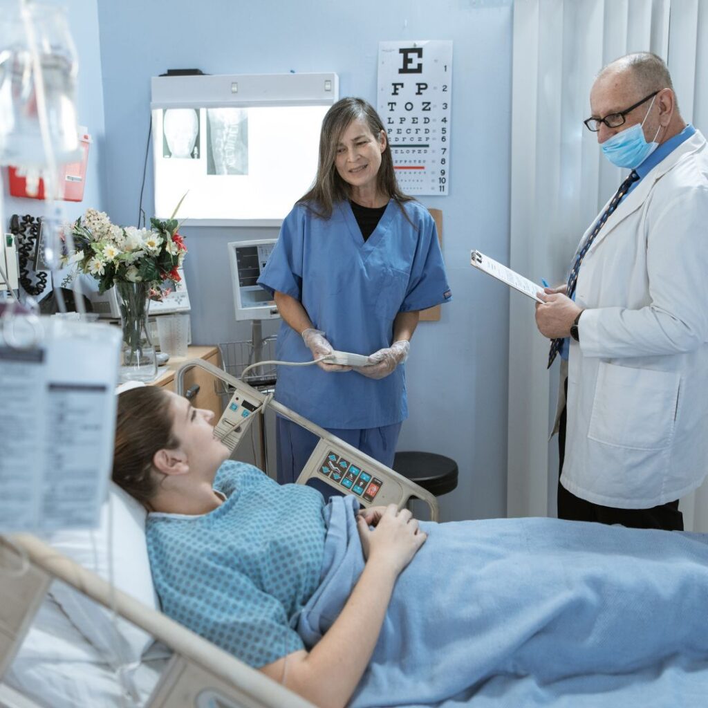 Nurse and doctor speaking to a patient