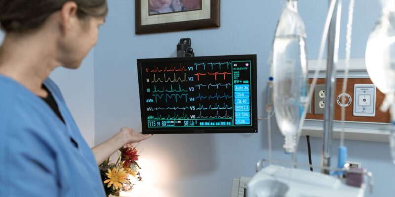 Nurse looking over a patient